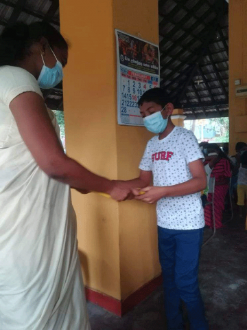 Thalapathpitiya Rural Development Society General Meeting and in parallel donating school books(2022-02-26)