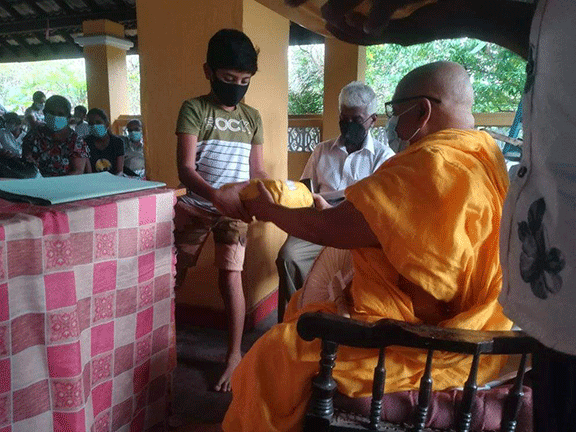 Thalapathpitiya Rural Development Society General Meeting and in parallel donating school books(2022-02-26)
