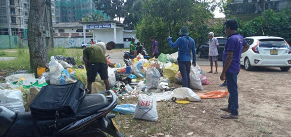 496 Kottawa South  Clean up the area around the Grama niladari officer's office and the society's grounds and conduct garbage collection